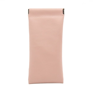 Close-up of light pink PU leather pouch with metal spring closure and stitching details