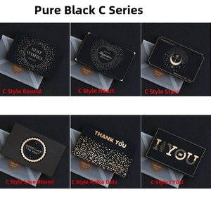 Detail of luxury black gold foil greeting card collection with frosted envelopes