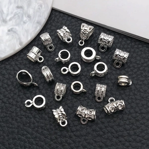Detailed view of silver alloy large hole beads and connectors for DIY necklace jewelry