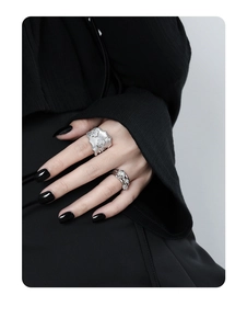 Close-up of S925 sterling silver multi-layer rings with zircon flower on a model's hand