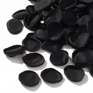 Macro shot of black satin silk rose petals with heat-pressed edges for wedding decor