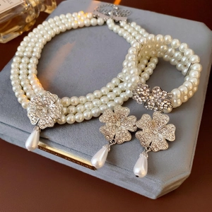 Three-piece multi-layer pearl jewelry set with diamond flower and waterdrop pendants