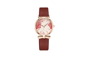 Detailed macro view of the rose gold bezel and leaf print dial on this Tadi quartz watch
