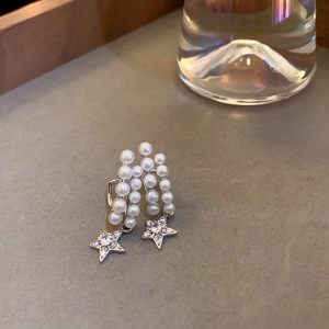 Elegant silver star earrings with rows of pearls and sparkling diamond accents
