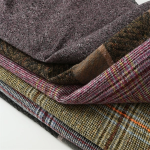 Detailed macro view of high-quality imitation cashmere fabrics with diverse textures and patterns
