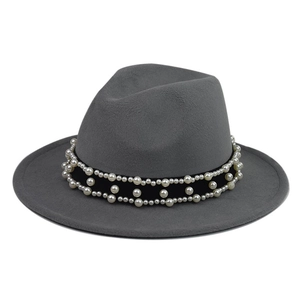 Detail of grey wool fedora hat featuring black velvet band with elegant white pearls