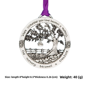 Detail of Tree of Life memorial ornament in vintage zinc alloy with purple ribbon