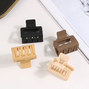 Set of four 5cm matte square claw clips in black, brown, beige, and cream colors