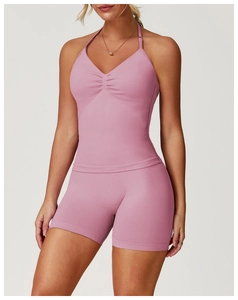Detailed view of pink halter neck sports vest with ruching and high waist fitness shorts