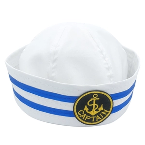 Detail of white captain hat featuring blue ribbon stripes and embroidered anchor badge