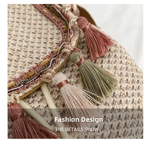 Macro view of handmade straw bucket bag featuring colorful tassels and bohemian woven details