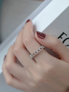 Close-up of silver chain ring with micro-pave zircons worn on model finger