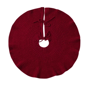 Round deep red knitted Christmas tree skirt with ruffles and tie closure on white background