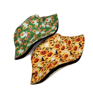Detail of Halloween bucket hats showing ghost, pumpkin, and spider web prints