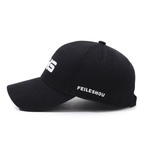 Classic black cotton baseball cap with white 3D letter embroidery in a side-view shot