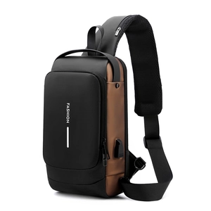 Detail of multi-functional chest bag with external USB charging port and FASHION logo