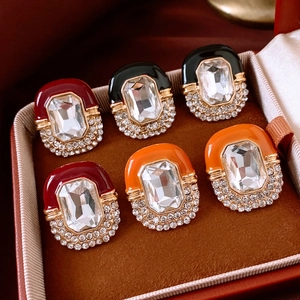 Detail of vintage palace style earrings with enamel finish and sparkling crystal accents