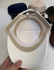 Close-up of the inner stitching and cotton-blend lining of the vintage flat top military cap