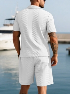 Rear view of white knit polo and shorts set with textured geometric patterns for men
