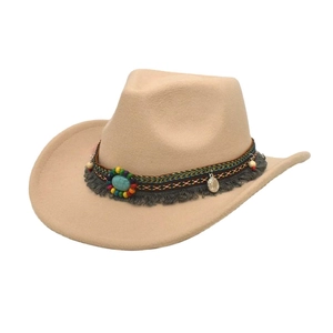 Detail of western wool fedora featuring ethnic woven band, turquoise stone and tassels