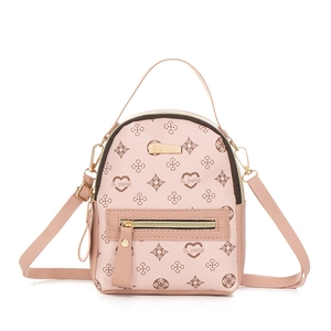 Pink mini backpack with vintage heart prints and adjustable straps for women