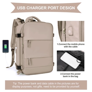 Detail view of beige travel backpack featuring integrated USB charging port and internal cable