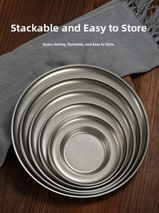 Nestable vintage stainless steel pasta plates showing matte brushed silver metal texture