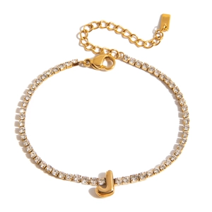Close-up of gold plated tennis bracelet featuring a micro-pave zircon letter J charm