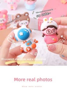 Close-up of cute cartoon astronaut pencil sharpener held in hand for children