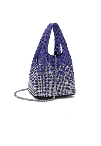 Detailed macro view of gradient blue and silver rhinestones on the elegant evening bucket bag