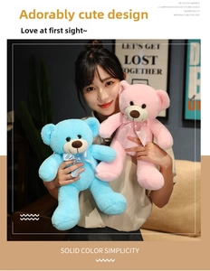 Detail showing the size and soft plush texture of teddy bears held by a model
