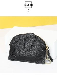 Detailed view of black elephant coin purse with leather texture and gold zipper