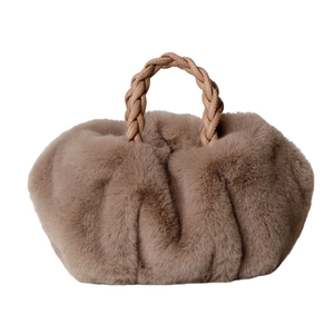 Taupe faux fur pleated handbag with woven leather handle on a plain white background