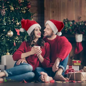 Cozy red Christmas hat and sweater set for adults featuring white plush pompom detail