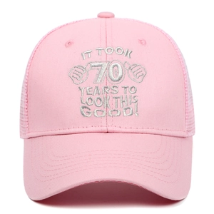 Pink cotton mesh trucker hat with 70th birthday silver embroidery on a white background