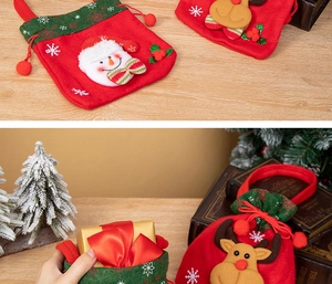 Detail of Christmas felt gift bags featuring 3D snowman and reindeer plush appliques