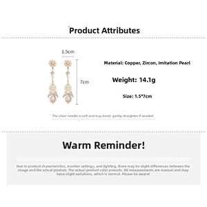 Detailed view of long gold drop earrings with zircon flowers, pearls and 7cm dimensions