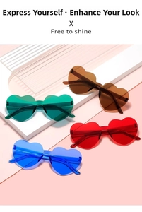 Detail of four colorful heart-shaped rimless sunglasses in transparent jelly shades