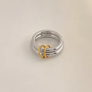 Minimalist stainless steel double ring with silver wide band and gold accent in US size 8