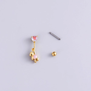 Golden bear pendant earring with pink gemstone and steel screw back on purple backdrop