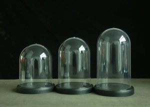 Three clear acrylic display domes in small, medium, and large sizes with black bases