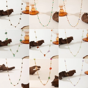 Detailed grid view of diverse stainless steel necklaces with colorful natural stones