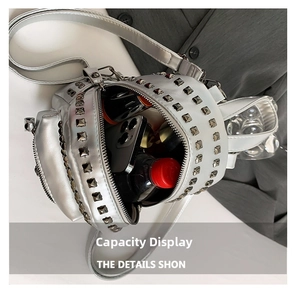 Internal storage capacity of a silver punk backpack with rivets and metallic finish