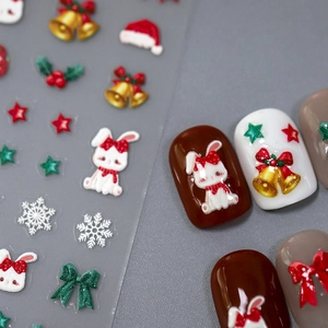3D Christmas nail stickers with bunny, bells, and snowflakes on matte finished nails
