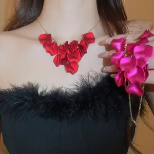 Minimalist red petal tassel necklace with velvet texture and matching floral bracelet