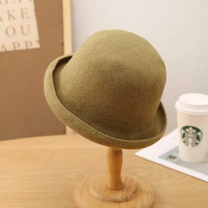 Vintage moss green wool felt bowler hat for women with a stylish rolled brim design