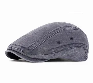 Detail view of navy blue washed canvas newsboy hat with breathable metal eyelets