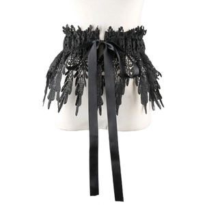 Close-up of black lace waist cincher with intricate feather patterns and satin ribbon ties