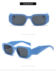 Macro view of blue geometric sunglasses with wide temples and dark lenses