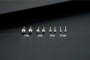 Detail view of S999 sterling silver ball studs in 2.5mm to 5mm sizes for multiple piercings
